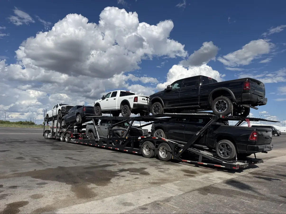MOV MY CAR carrier hauling Ram trucks in daylight on the Houston to Austin route